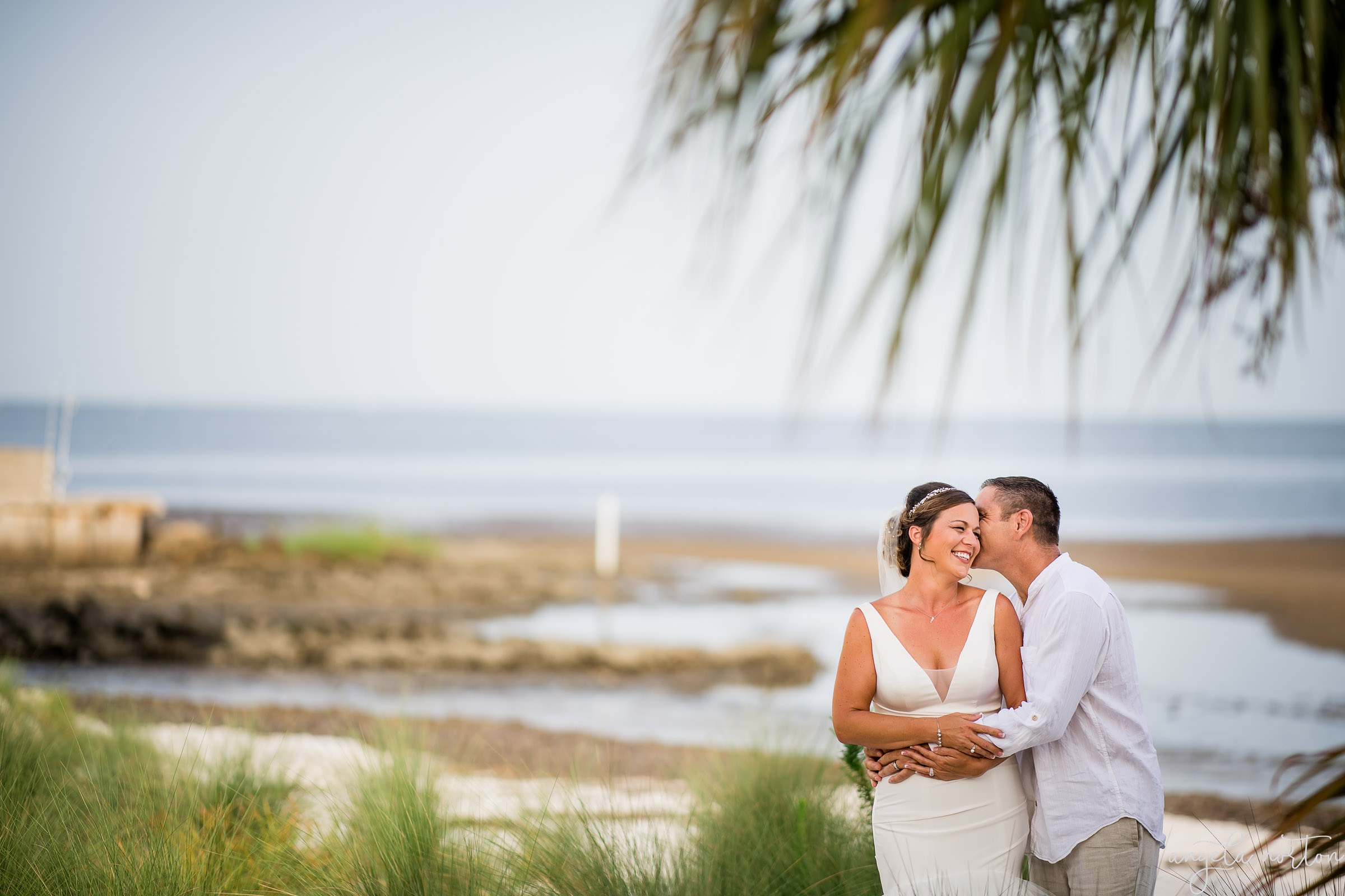 A bridal session for the bride and groom at the beach in Cedar Key Florida by Angela Norton Photography