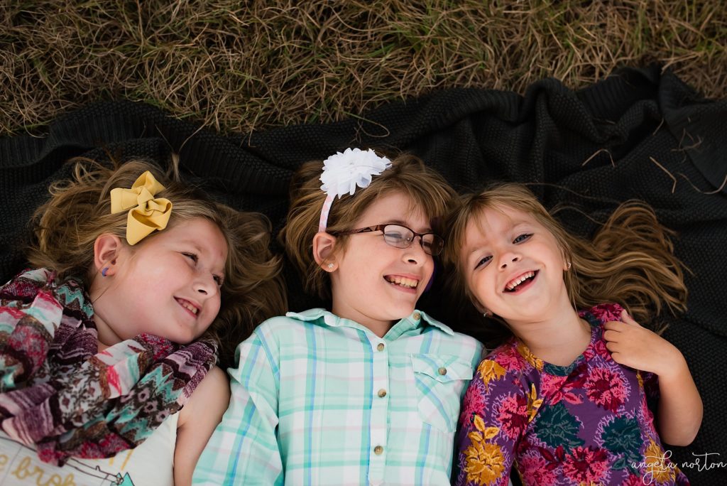 kids-smiling-on-blanket-angela-norton-photography