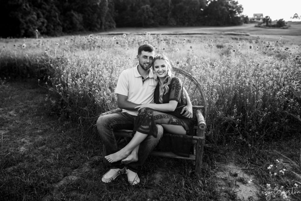 A sunset engagement session in a sunflower field in Micanopy Florida by Angela Norton.